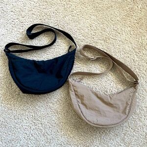 Two Uniqlo shoulder / crossbody bags, black and tan, unisex.